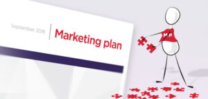 Image of a figure building a marketing plan with puzzle pieces.